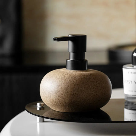 Ceramic Dispenser with Pebble Design and Matte Black Pump